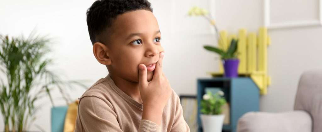 Boy practicing speech exercises for speech delay.