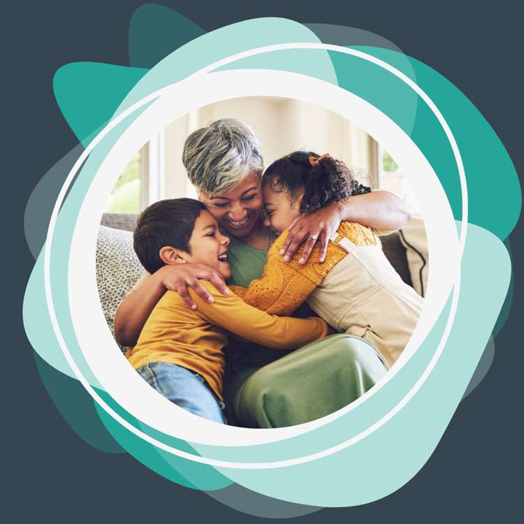 Grandmother enjoying quality time with grandchildren, highlighting the joy of effective family speech therapy.