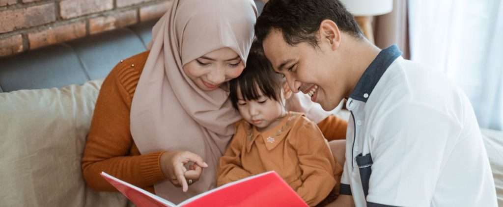 Parents reading with toddler, engaging in language development activities.